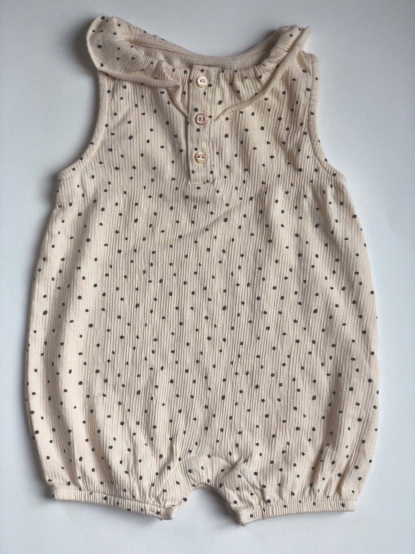 Barboteuse beige à pois noir Kiabi 6 mois