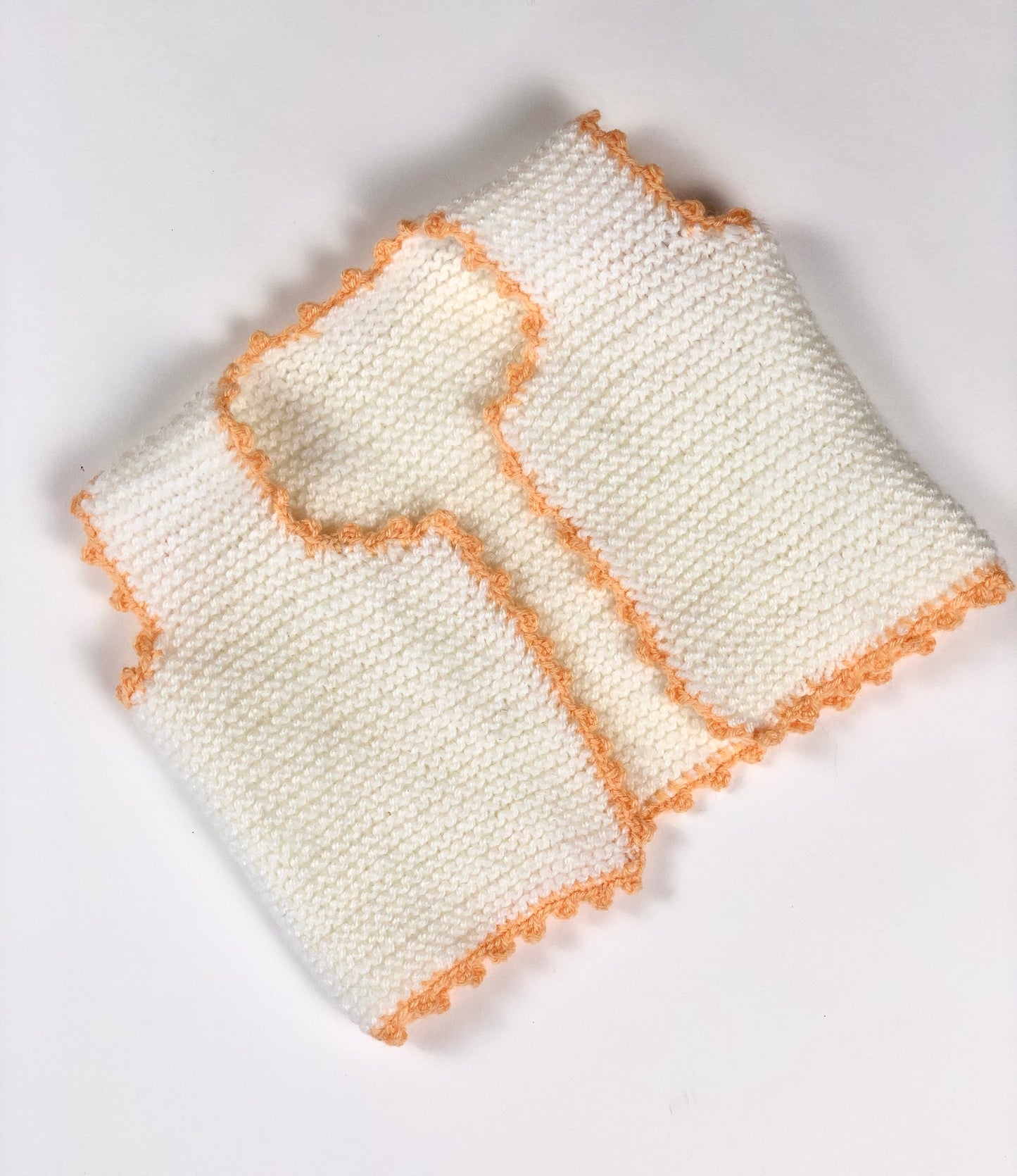 Gilet en mailles 6 mois blanc et pêche fait main